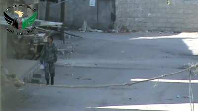 Al-Hafriya neighborhood, Damascus - 02/12/2013  - Nour al-Haq Battalion snipes one of Assad's Soliders