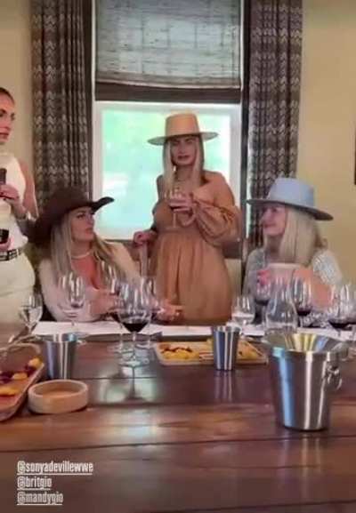 Mandy Rose drinking wine