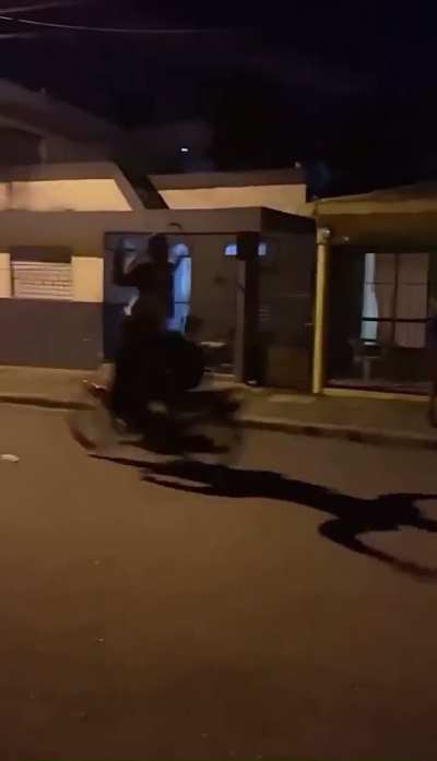 Dude tries to jump over speeding motorcycle, cripples himself.