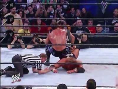 HBK’s Sweet Chin Music on Chris Benoit while giving The Sharpshooter to HHH