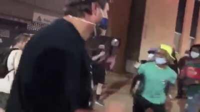 Protesters surrounding and beating journalists