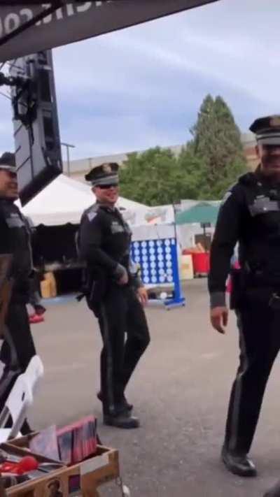 Blursed police officer caricature.