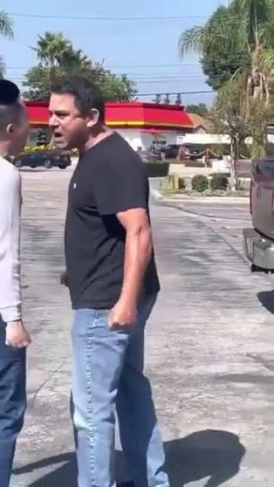 Passenger confronts man who called driver a racial slur during parking lot incident