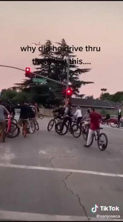 Truck hits bicycle riders who are illegally in the intersection.