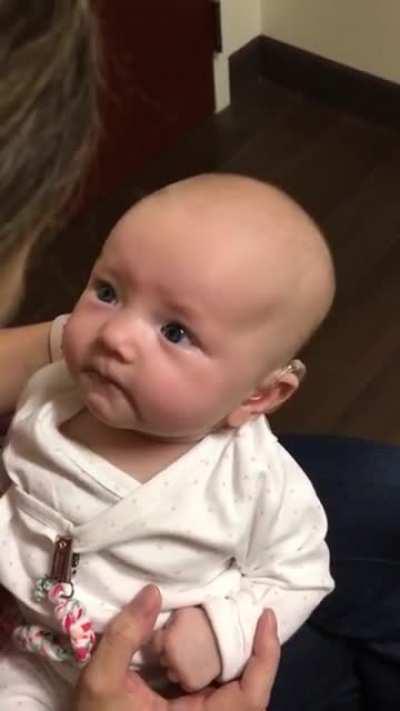 Baby hears her mothers voice for the first time and is almost moved to tears