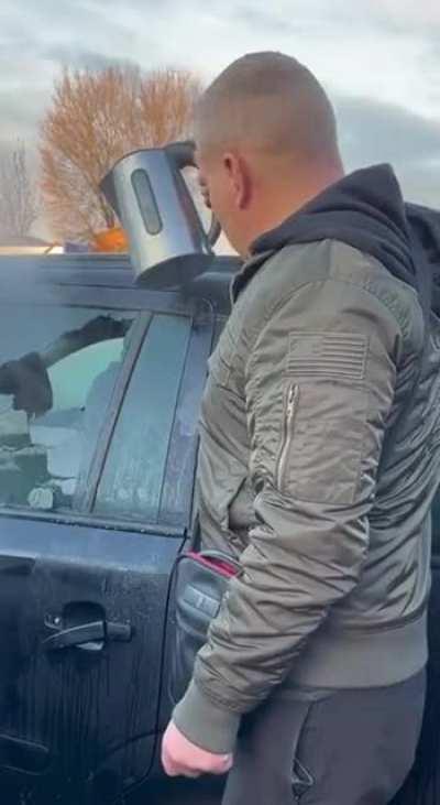 Removing ice off a car window