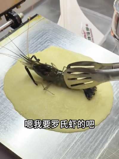 Street vendor flattens a live prawn onto pancake batter. Apparently good for your calcium intake.