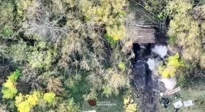 Ukrainian drone dropping multiple explosive on Russian soldiers in a trench (2022)