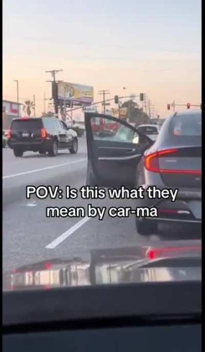 Man uses axe to break back window of car that honked at him