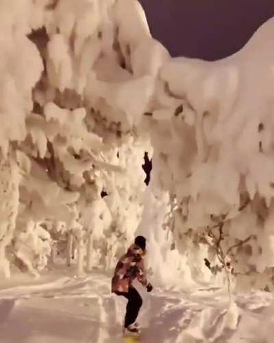 Snowboarding at night time.