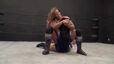 Barbi isn't done with her jobber Santana after the pin, as she slams her limp opponent and and makes her tap out in a deep camel clutch