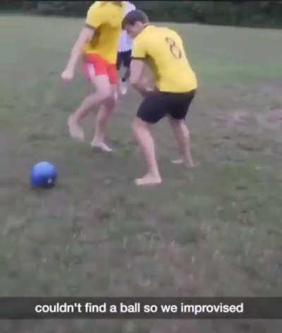 Playing football with a bowling ball.