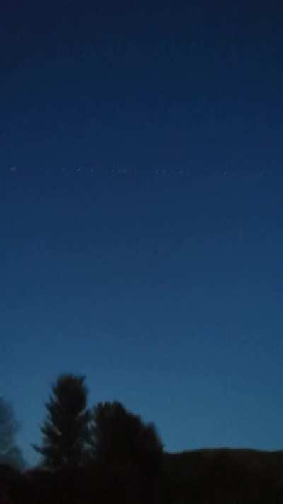 Starlink satellites seen in the early morning while camping. I thought I was seeing aliens...