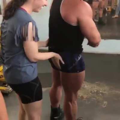 Guy lets a blind girl at the gym feel his muscles, it puts the biggest smile on her face
