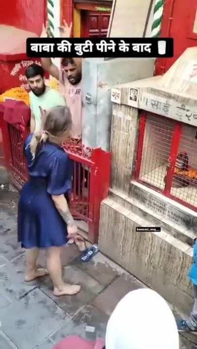 Drunk foreigner menacing locals in a religious site, India