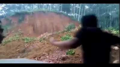 Landslide almost buries motorcycle rider