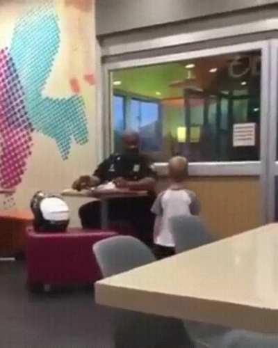 Little boy just wants to hug the police officer