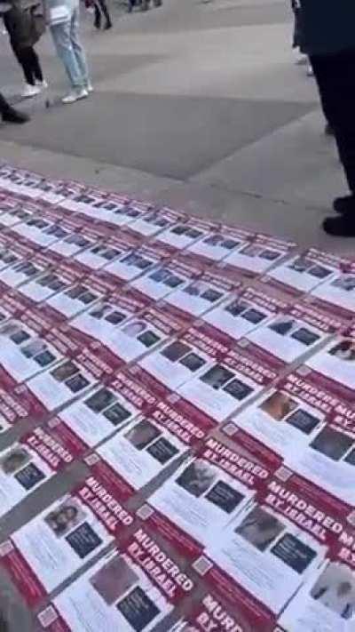 Cops remove pictures of Palestinians killed by Israel outside the White House.