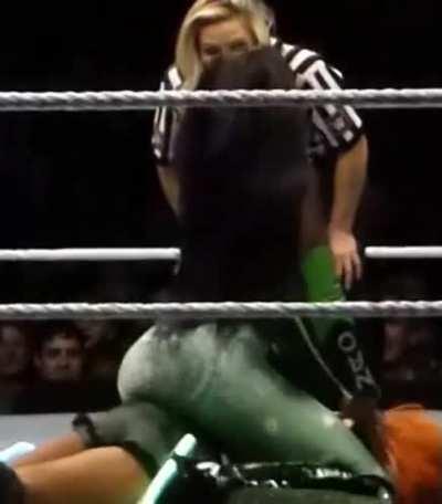 Naomi sitting on Becky.