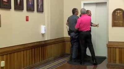 Baby killer punched in the face leaving courtroom