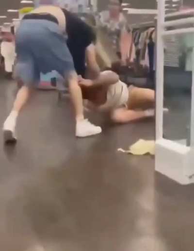 Two guys going at it in a store (UK)