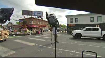 Reporting live from the George Floyd Autonomous Zone in Minneapolis this morning a journalist is interrupted by a drive by shooting right behind him