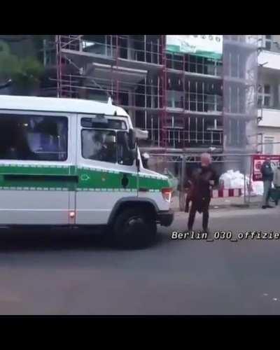 Standing in front of a police car is a very good idea