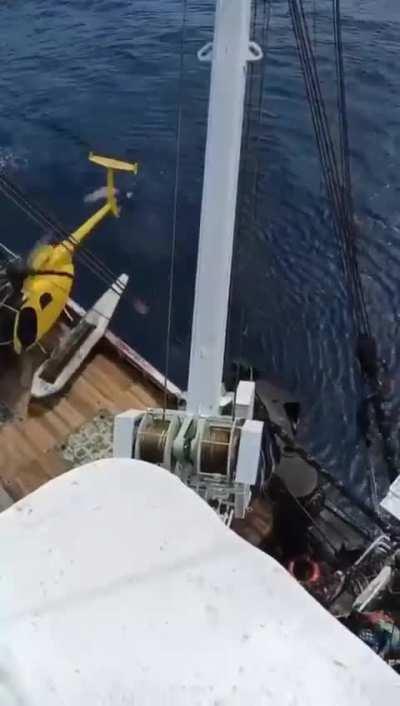 Lost tuna pilot makes a tough call. Try to land on the working deck or run out of fuel. The helicopter on the helideck was apparently broken and unable to be moved.