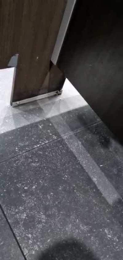 A guy tugging his belt