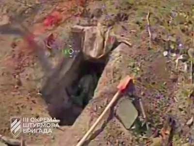 Ukraine 2023/08/26- ANDRIIVKA - a FPV drone hits a hole where a Russian soldier had taken refuge