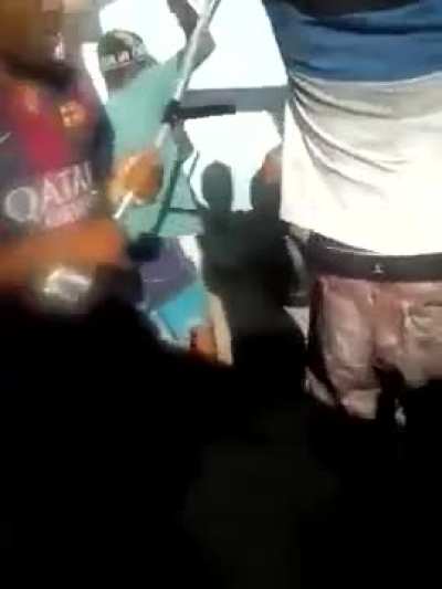 Angry mob beats a pedophile with sticks after he tried to touch a 5 year old girl