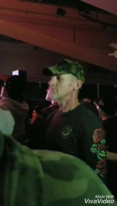 Daughter signing for her father at a rock concert