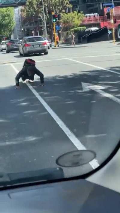 It's an illusion, he's actually pushing the earth down