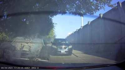Dude tries to exit last minute, hits another car, turns over, hits me, then runs away. How fun.