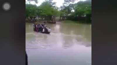 D or V after Overloaded boat sinks in Croc infested water.