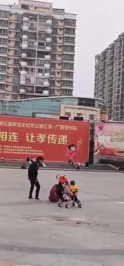 Man beats up a woman in front of her child