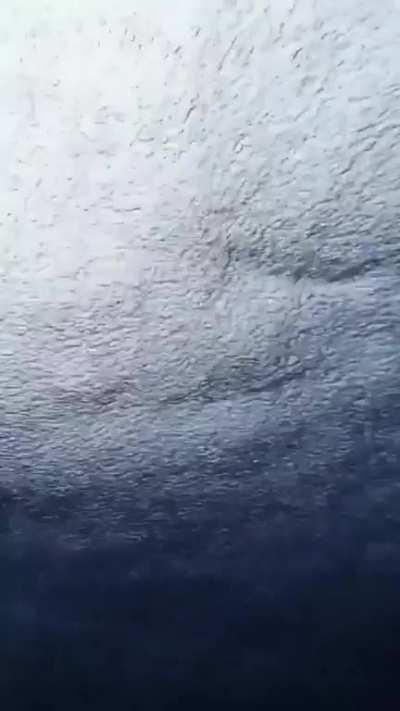 Swimming underwater during a tropical storm