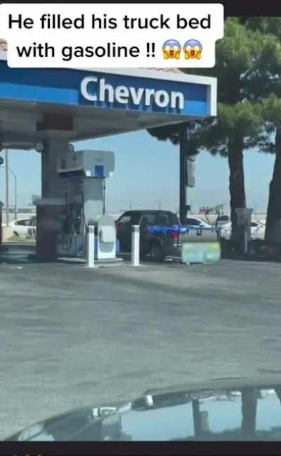 Part 2 of the guy filling up his truck bed with gasoline.