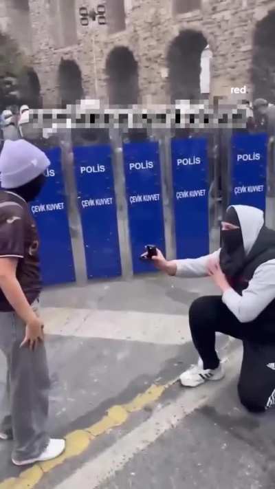 Marriage proposal in front of riot police in Istanbul, Turkey