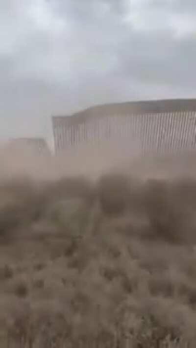 Hurricane Hanna blowing over Trump’s mighty border wall between the United States and Mexico....