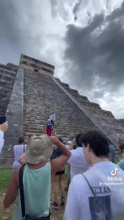 Disrespectful woman climbs a Mayan Pyramid and gets swarmed by a crowd when she comes down