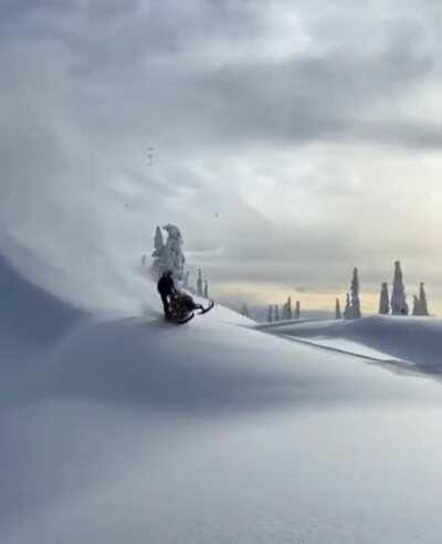 Back flipping a snow machine