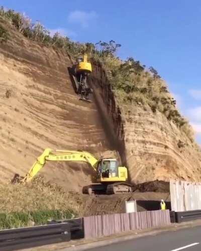 Specialized excavator to excavate off on a cliff(x-post)