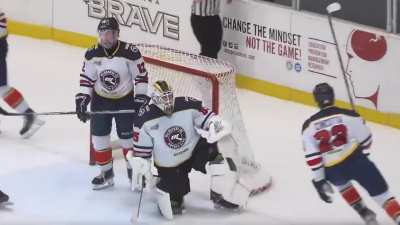 Canberra Brave forward Tommy Steven pulls a cutthroat celebration after scoring against Melbourne Ice goalie Tatsunoshin Ishida.
