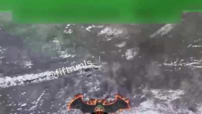 Russian artillery strikes Ukrainian soldiers walking through a field and a drone drops a grenade