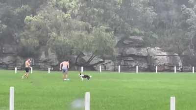 People enjoying the rain at Tunks park Cammeray.
