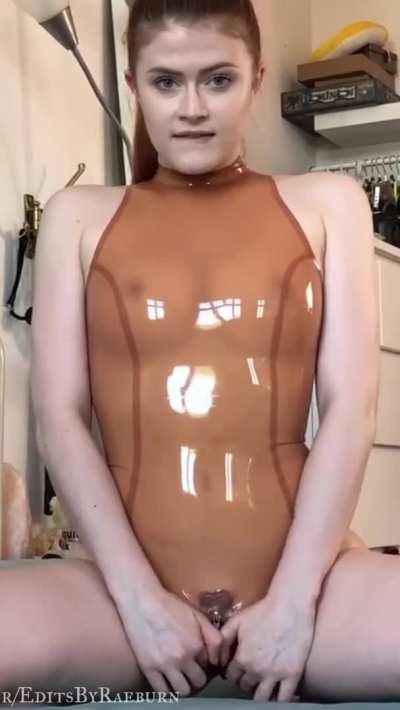 Unzipping her latex one piece to flash her pussy