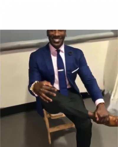Shannon Sharpe in suits with Vivaldi’s Winter in the background