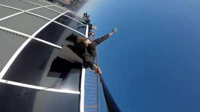 Shiey hanging off the tallest building in Kiev by his feet