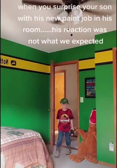 He dosen't know yet that painting a room is not fun.